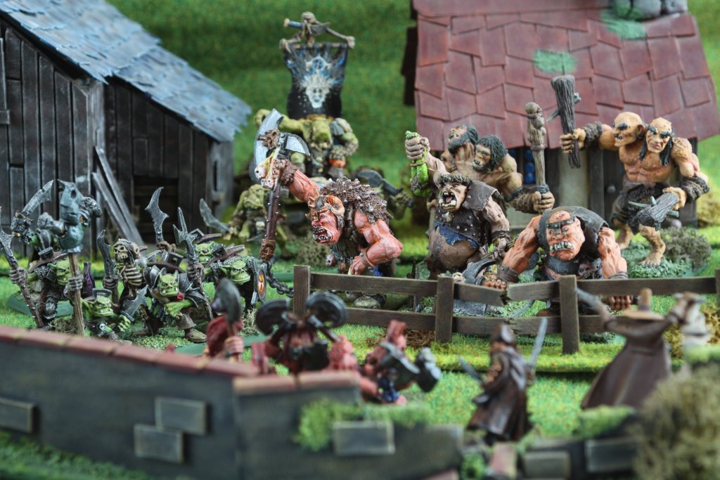Orcs and Ogres battling Dwarves