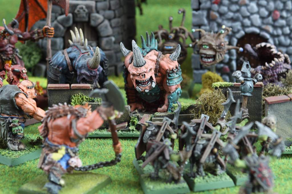 Demons battling Orcs and Ogres